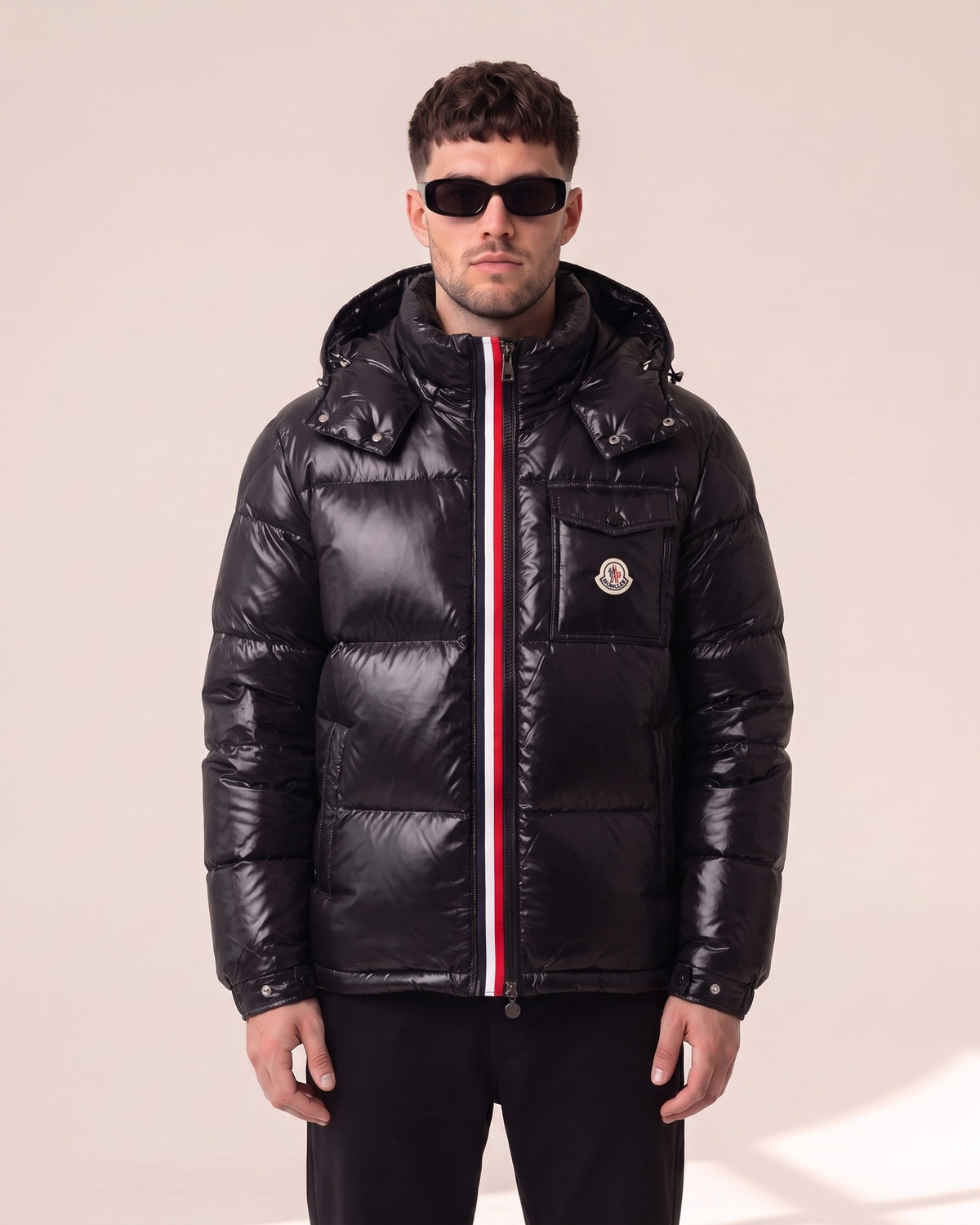 Moncler Maya glossy hooded down jacket in black