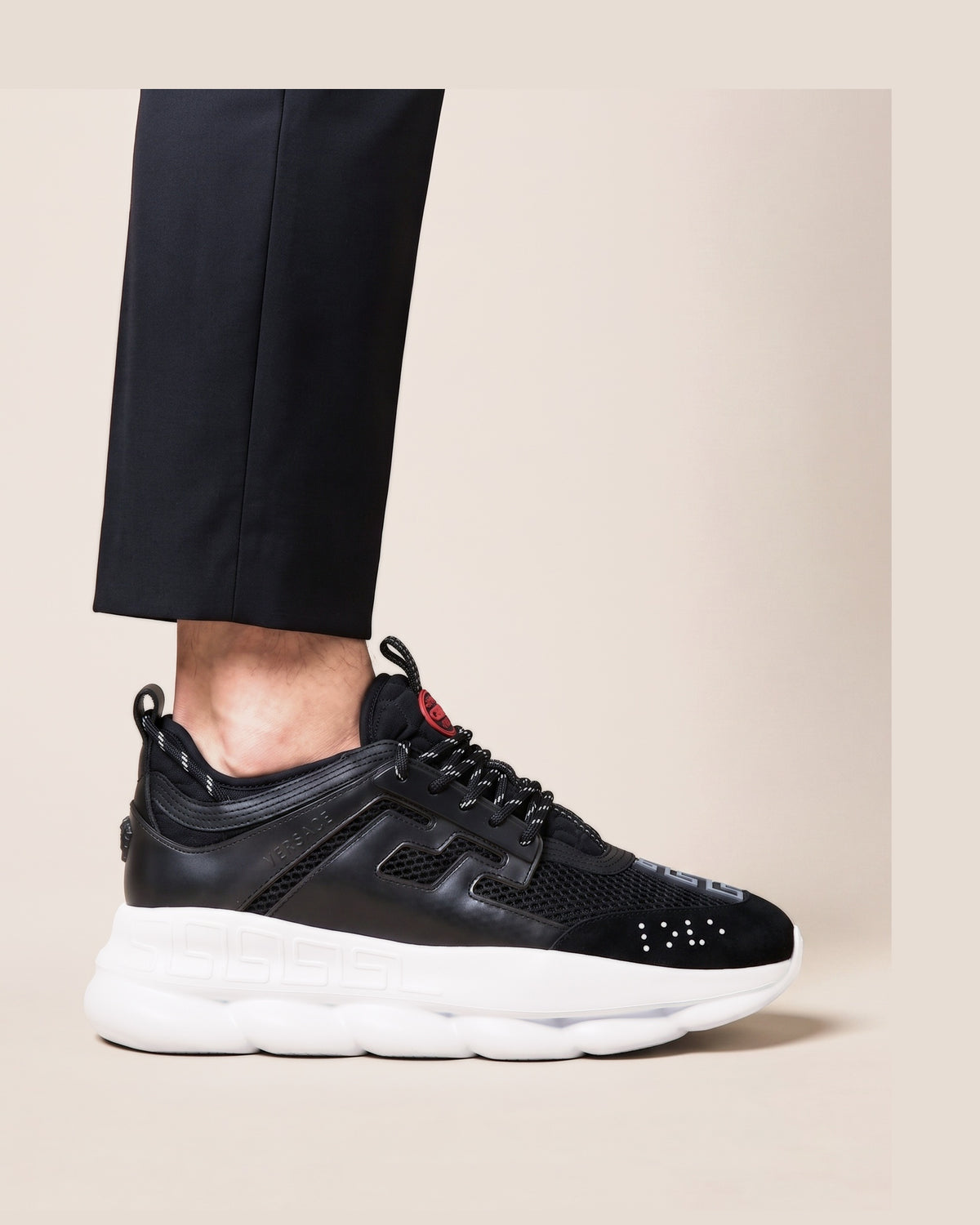 Versace Chain Reaction sneakers in black with a white chain link sole
